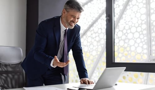 A smiling lawyer during a videoconference negotiation