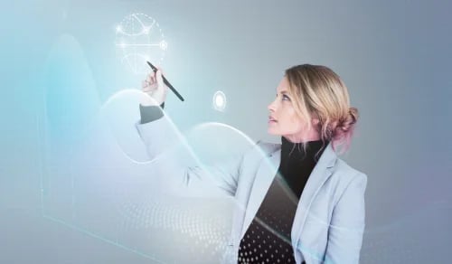 A lawyer in a suit interacts with a hologram using a touch pen. Bigle Legal CLM article on AI.