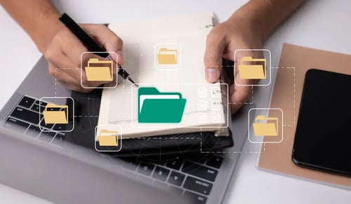 Representation of digital folders on two hands working manually