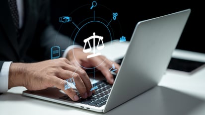 businessman-using-laptop-showing-judge-scale-icon-tablet-table-technology-innovation-virtual-screen-concept-law-justice-legal-services-business-legislation