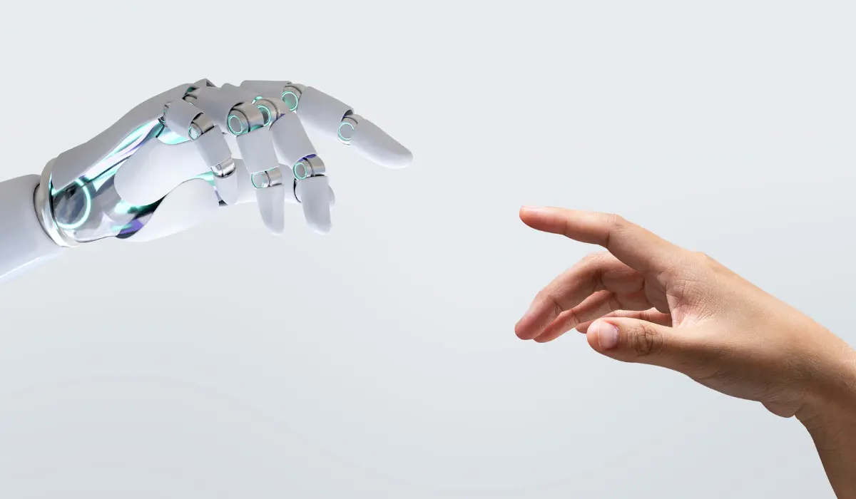 Mano robótica a punto de tocarse con una humana. Artículo de Bigle Legal sobre la IA.